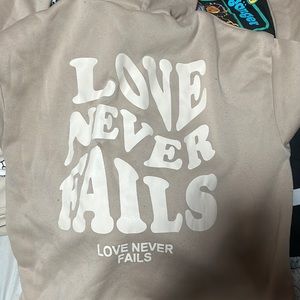 Love never fails only detailed on the back good for the cold nights